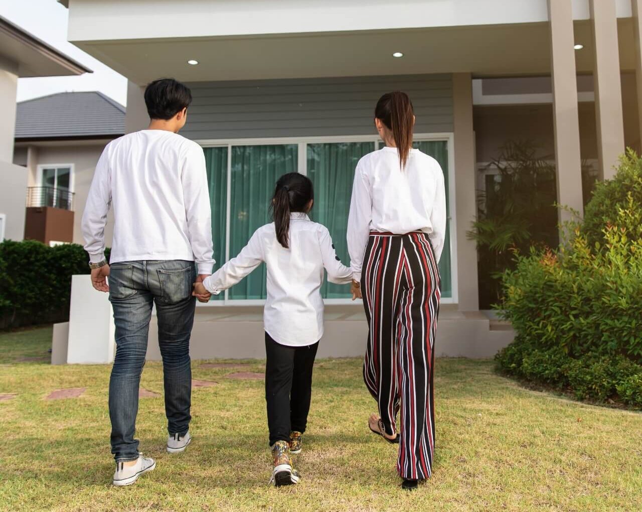 A family walking together in Kuala Lumpur, illustrating who can be included as a dependant under the MM2H programme